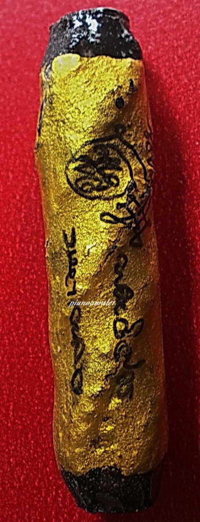 ตะกรุดโทนเก่า ไส้ตะกั่ว จุ่มรักทาทองลงจารย์เคลือบแล็ค