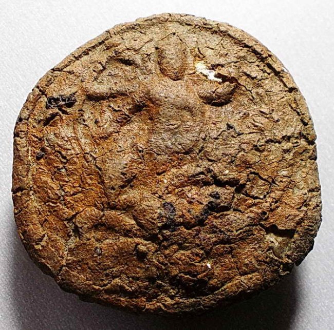 พระพิมพ์ลูกเนียงศรีวิชัย กรุกรุพุนพิน เนื้อดินดิบ จ.สุราษฎร์ธานี 